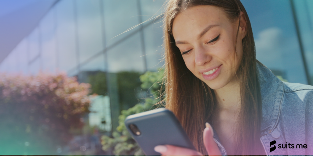 Image of a woman holding a smart phone using a mobile banking app