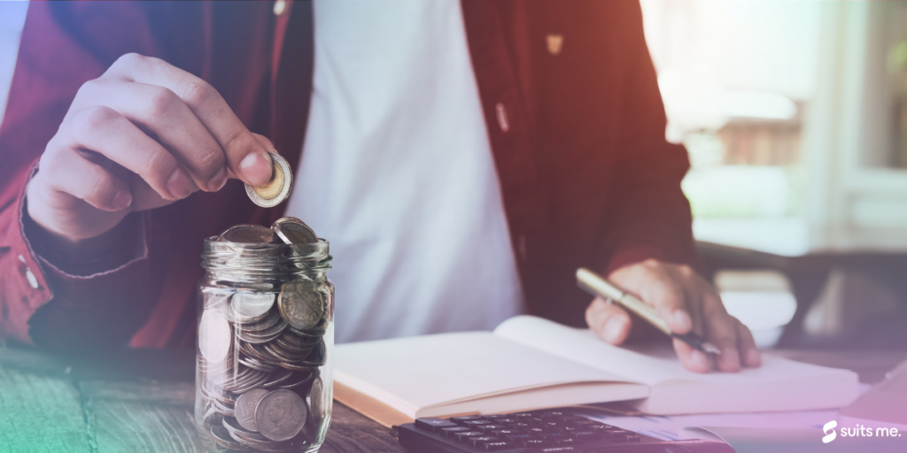 A man checking his finances and putting money into his saving jar as one of the money saving tips