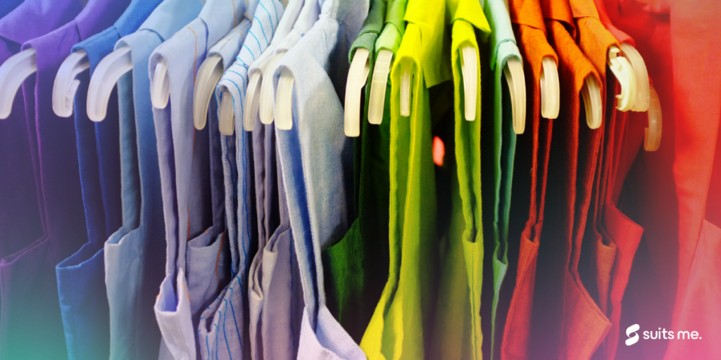 multi coloured clothes on a clothing rail