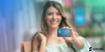 Woman holding a blue debit card