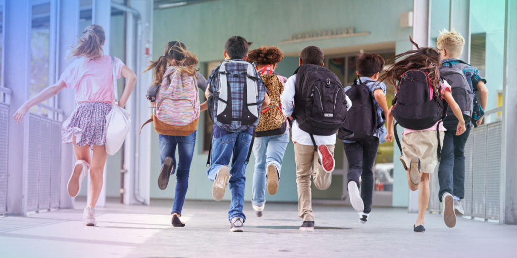 School children running in a corridor going to a lesson were they should be given financial advice