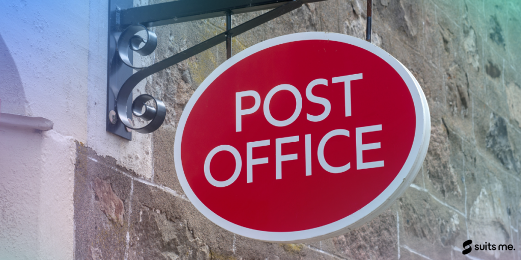 Post office red logo on the outside of a shop