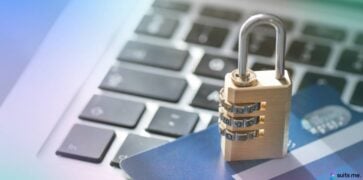 Picture of a laptop keyboard with a padlock and debit card which represents the banking security when banking online or via a mobile