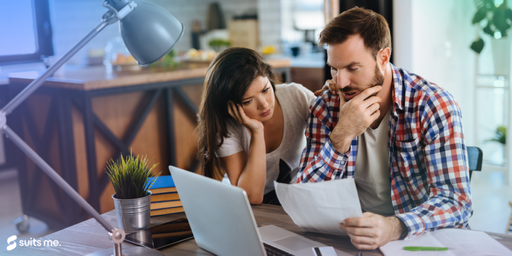 A man and women stressing about paying there bills making it harder as they do not have a bank account