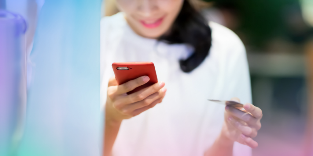 Self employed worker using card and phone to make a payment