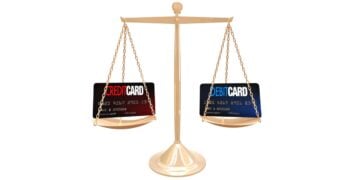 Credit Card Vs Debit Card Balancing on Kitchen Scales