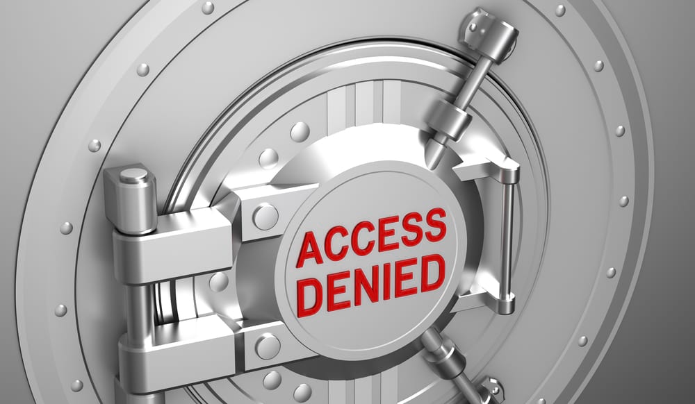 Access Denied in bold text on a locked banking vault