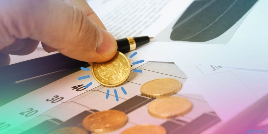 Man assessing his cash on top of financial papers