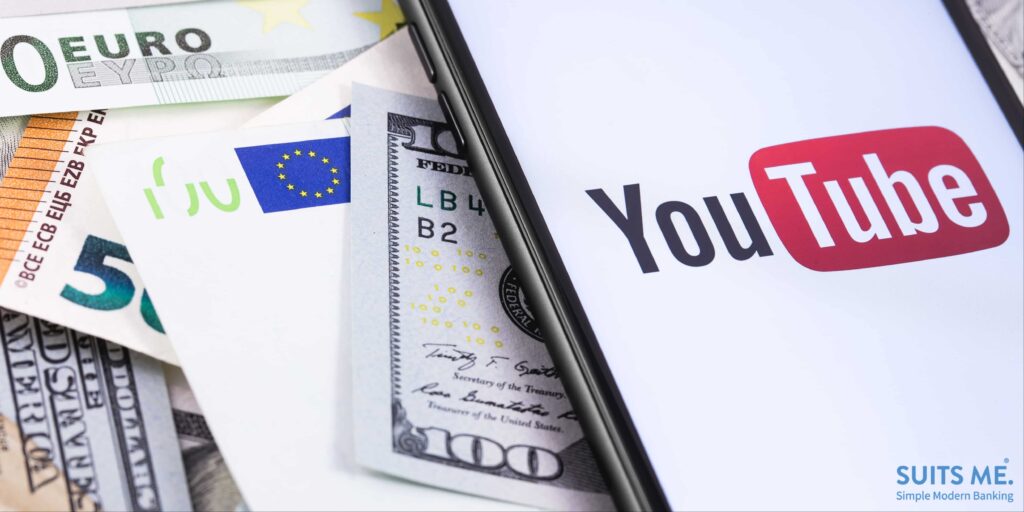 dollars, euro banknotes and YouTube logo on the screen smartphone. Representing Financial YouTubers who make content about money.