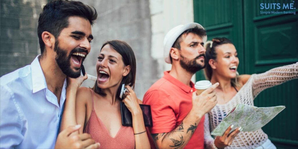 Young appy tourists sightseeing whilst on holiday and not worrying about currency