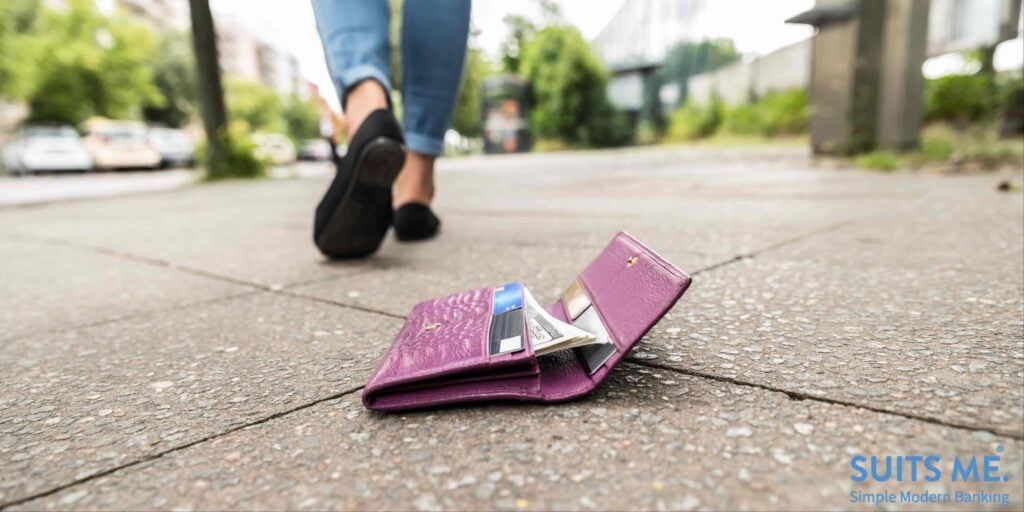 Woman Walking Away Without Realising She's Lost Her Wallet With Money and Bank Cards