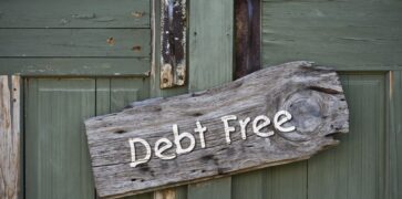 Debt free sign on green door