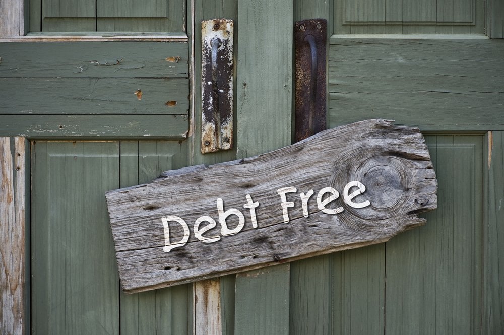 Debt free sign on green door