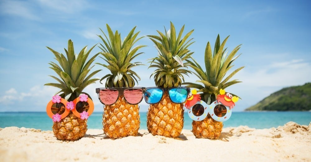 Pineapples on a Beach with Sunglasses