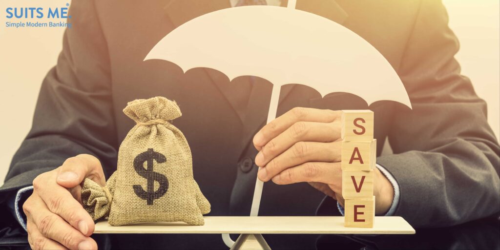 Savings protection / keep money safe concept : Businessman holds a white umbrella protects or guards a dollar money bags on a balance scale, depicts protection when bank or building society goes bust.