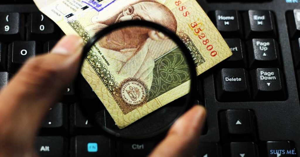 Indian Rupee on top of a keyboard - representing 40% of Indians using online banking to manage their finances