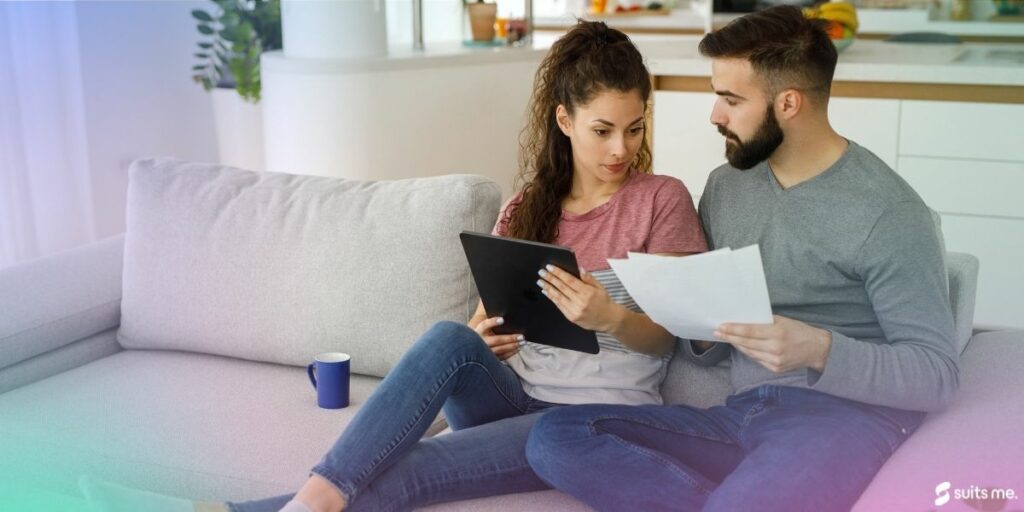 couple looking through their outstanding debts to see if they can write off debt