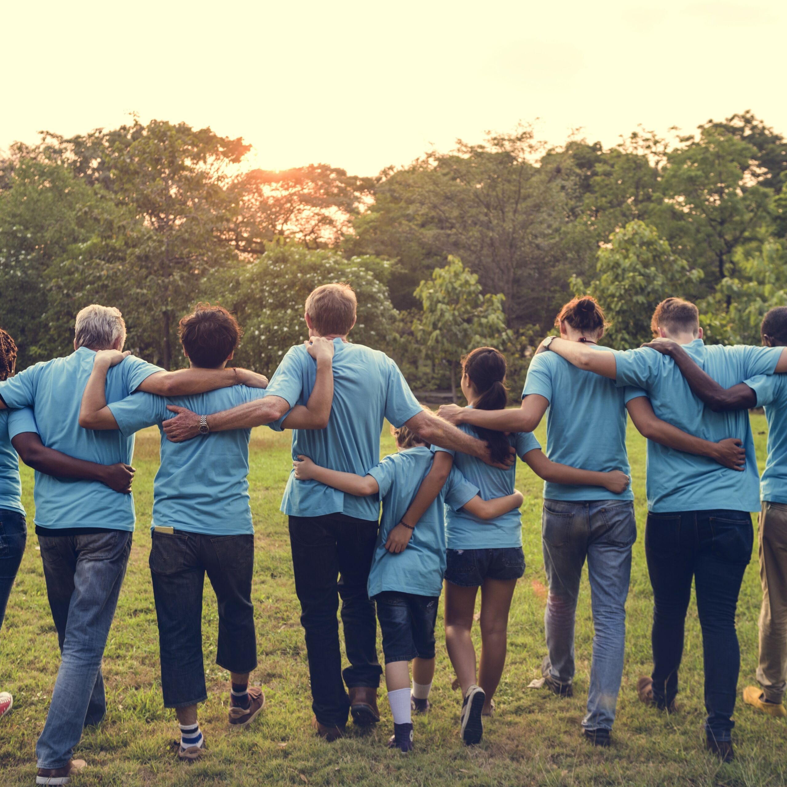 Charity community with arms around each other