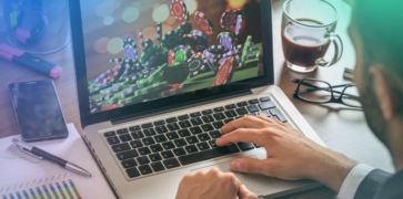 Man on his laptop playing gambling online
