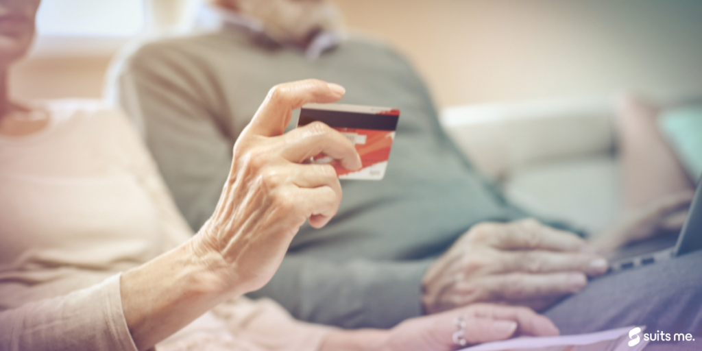 Woman using her basic bank account debit card.