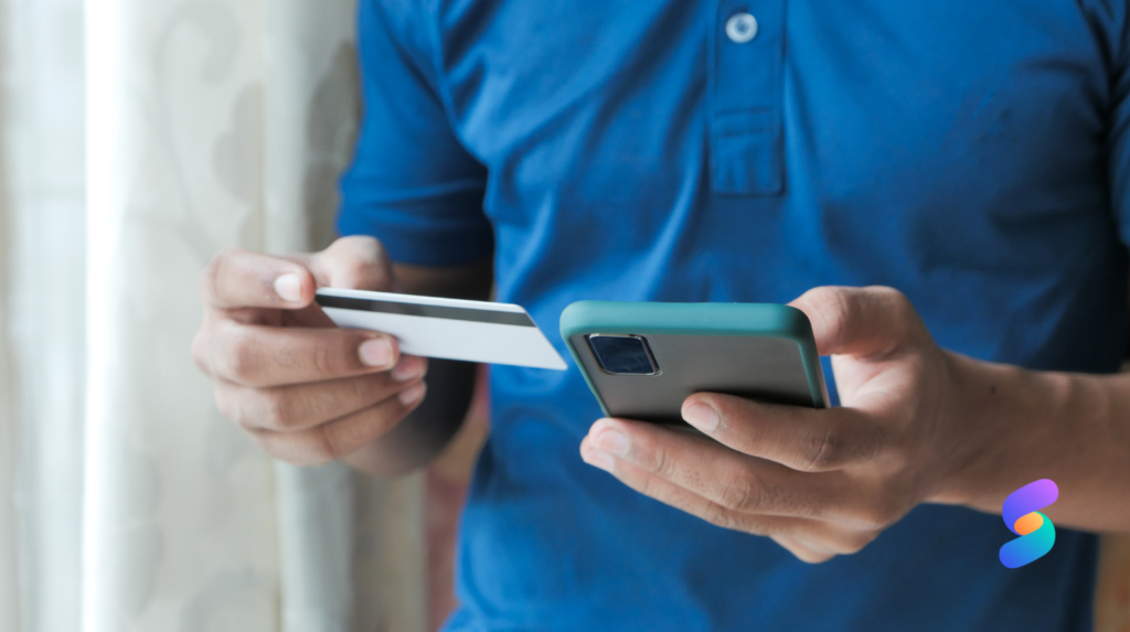 person paying by card over phone