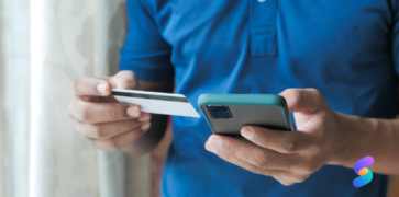 person paying by card over phone